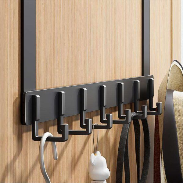 Black aluminum over-the-door hook rack showing installation on wooden door