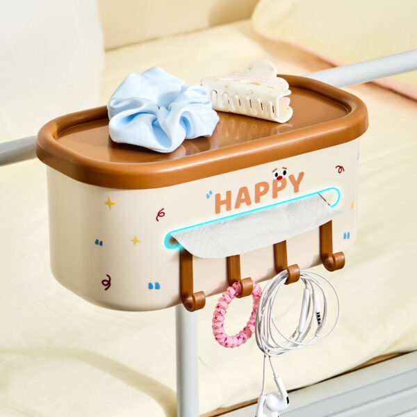 Cartoon bedside storage caddy with hooks hanging on bed rail