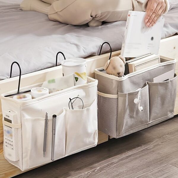 Two cotton linen hanging storage bags used on bedside rail