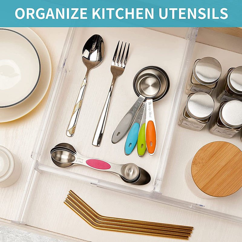 Expandable drawer dividers organizing stationery and small items