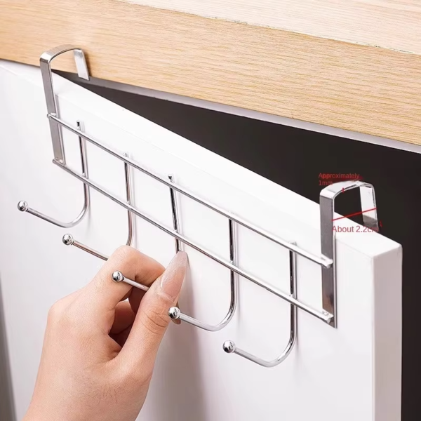 Stainless steel over-the-door hook rack installation detail on cabinet door