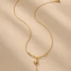 Gold star drop necklace made with water-resistant stainless steel