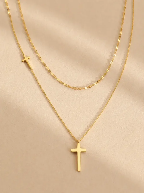 Gold layered cross pendant necklace with adjustable chain