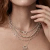 Model wearing silver layered toggle heart necklace