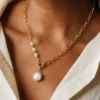 Model wearing gold irregular pearl pendant necklace