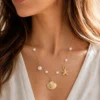 Model wearing gold irregular pearl pendant necklace