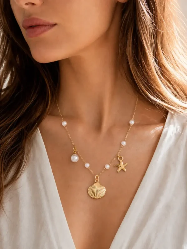 Model wearing gold irregular pearl pendant necklace