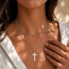 Water-resistant silver layered cross pendant necklace worn on model