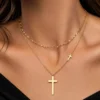 Gold layered cross pendant necklace with adjustable chain