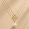Gold geometric pearl pendant necklace product image