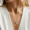 Model wearing 925 sterling silver ruby red gemstone halo necklace