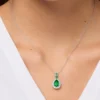 Model wearing 925 sterling silver emerald green gemstone pendant necklace