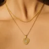 Model wearing 18K gold-plated heart layered necklace