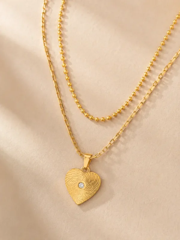 18K gold-plated textured heart layered necklace close up