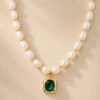 Freshwater pearl necklace with green stone pendant close up