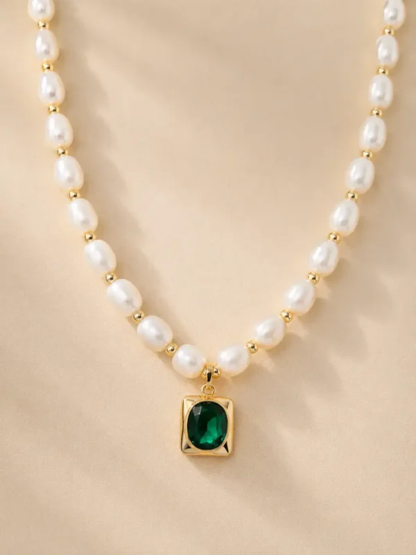 Freshwater pearl necklace with green stone pendant close up