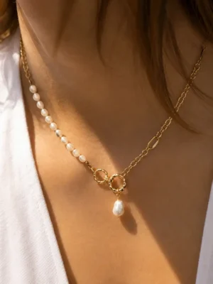 Model wearing gold freshwater pearl toggle necklace